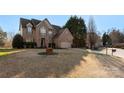 Lovely brick home with an attached two-car garage and a spacious front yard at 2283 Iron Works Dr, Clover, SC 29710