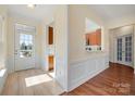 Bright entryway with tile flooring and natural light, adjacent to the living area and kitchen at 23072 Whimbrel Cir, Fort Mill, SC 29707