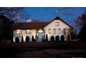 An elegant home with a white brick facade, manicured landscaping, and a welcoming entrance at 241 Spring Run Dr, Mooresville, NC 28117