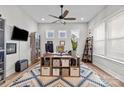 Well-lit home office featuring a ceiling fan, stylish furnishings, and a cozy work environment at 2419 Paddlers Cove Dr, Clover, SC 29710