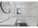 Well-lit bathroom with modern fixtures and a tub, offering a relaxing space at 2529 Grimes St, Charlotte, NC 28206