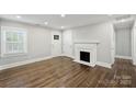 Bright living room featuring hardwood floors, fireplace, and lots of natural light at 2529 Grimes St, Charlotte, NC 28206