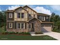 Striking two-story home with stone accents, large windows, and a two-car garage at 2534 Crimson Way, Monroe, NC 28112