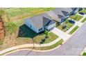 Overhead view of a well-kept lawn and single-story home located on a cul-de-sac at 324 Aniston Ln, Shelby, NC 28152