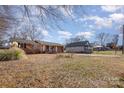 Traditional brick home with a welcoming front porch and well-maintained landscaping at 437 Valley St, Stanley, NC 28164