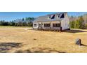 Lovely home with a spacious front yard, porch, and dormer windows at 453 Cedar Grove Rd, Clover, SC 29710