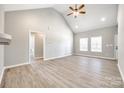 Bright living room features vaulted ceilings, wood-look floors, and neutral paint at 453 Cedar Grove Rd, Clover, SC 29710