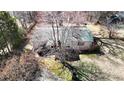 Aerial view of charming home with mature trees, providing shade and privacy at 5124 Gates Dr, Denver, NC 28037