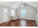 Bright living room with vaulted ceiling, ceiling fan, wood floors and a loveseat at 544 Castlewood Cir, Rock Hill, SC 29730
