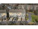 An aerial view of townhouses highlighting rear decks, backyard patios, and convenient parking spaces at 582 Sixth Baxter Xing, Fort Mill, SC 29708