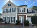 Charming two-story home with gray siding, dark shutters, and a well-manicured lawn in a desirable neighborhood at 5905 Waverly Lynn Ln, Charlotte, NC 28269