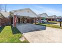 A well-kept brick home with a convenient carport and neatly manicured lawn, presenting a welcoming curb appeal at 7004 Owens Ct # B, Lowell, NC 28098
