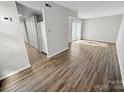 Spacious room featuring wood floors, neutral paint, and ample closet storage for modern living at 7140 Stonington Ln, Charlotte, NC 28227