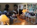 Spacious living room with hardwood floors, neutral walls, and ample natural light at 7426 Riding Trail Rd, Charlotte, NC 28212