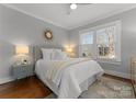 Cozy bedroom with natural light, hardwood floors, and comfortable furnishings at 843 Ideal Way # 10, Charlotte, NC 28203