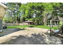 Spacious backyard featuring a large concrete patio and an outdoor gazebo at 908 Dogwood Dr, Gastonia, NC 28054