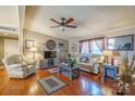 Cozy living room featuring hardwood floors, neutral walls, and comfortable furnishings at 1049 Ramsey St, Stanley, NC 28164