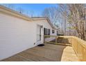 A spacious wooden deck offers an inviting outdoor space, perfect for relaxing or entertaining at 109 Fish Hill Dr, Statesville, NC 28677