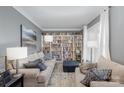 Cozy living room with built-in bookshelves and comfortable seating at 12441 Morning Creek Ln, Charlotte, NC 28214