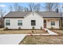 Beautiful single-story home with a well manicured lawn and walkway to the covered porch at 1507 W Davidson Ave, Gastonia, NC 28052