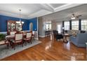 Open-concept living and dining area with hardwood floors and recessed lighting at 1796 Williamsburg Dr, Rock Hill, SC 29732
