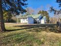 Exterior of home with covered parking, porch and grassy yard at 200 Hillcrest Ave, Hickory, NC 28601