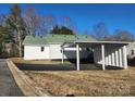 Exterior view of a charming home with a covered parking area and green roof at 200 Hillcrest Ave, Hickory, NC 28601