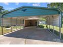 Spacious covered carport offering ample parking and protection from the elements at 208 Caleb Rd, Shelby, NC 28152