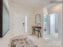Bright foyer with neutral walls, a wood floor, and a view into the bedroom at 2817 Morning Song Way, Lancaster, SC 29720