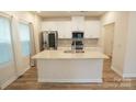 Beautiful kitchen featuring white cabinets, stainless steel appliances, and an island at 3207 Lisburn St, Charlotte, NC 28227