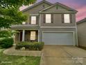 Charming two-story home with a two-car garage, neutral siding, and eye-catching red shutters at 3627 Alexander Forest Dr, Charlotte, NC 28269