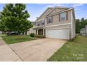 Charming two-story home with a two-car garage and a well-maintained lawn at 3627 Alexander Forest Dr, Charlotte, NC 28269