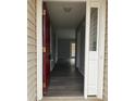 View of front door entry that leads to home's interior with neutral paint color and hardwood floors at 4226 Red Shed Ln, Charlotte, NC 28269