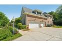 Spacious three-car garage with ample parking and well-maintained surroundings at 820 Hampshire Hill Rd # 106, Matthews, NC 28105