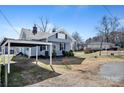 Charming home featuring a covered porch and carport in a quiet neighborhood at 97 Central Ave, China Grove, NC 28023