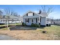Charming home featuring a covered porch and carport in a quiet neighborhood at 97 Central Ave, China Grove, NC 28023