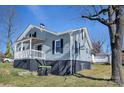 Charming home featuring a covered porch and partial basement at 97 Central Ave, China Grove, NC 28023