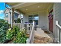 Inviting front porch with seating area and charming decorative details at 117 Stowe Rd, Belmont, NC 28012