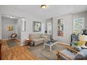 Cozy living room featuring neutral decor, hardwood floors, and plenty of natural light at 1714 S Tryon St, Charlotte, NC 28203