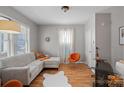 Inviting living room with modern furniture, hardwood floors, and bright accents at 1714 S Tryon St, Charlotte, NC 28203