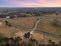 New construction home featuring an undeveloped landscape and a lush wooded area viewed from above at 2095 Tite Rd, Stanfield, NC 28163