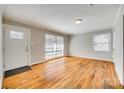 Spacious living room with hardwood floors, natural light, and neutral walls create a calming atmosphere at 2123 Purser Dr, Charlotte, NC 28215