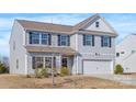 Well-kept two-story home with light gray siding, black shutters, a two-car garage, and a manicured lawn at 3010 Beacon Ave # 86, Monroe, NC 28110