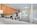 Cozy kitchen with white appliances, plenty of cabinets, and natural lighting at 331 Wilkes Place Dr, Fort Mill, SC 29715