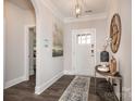 Welcoming foyer showcasing a decorative table, mirror, and a view of the home's interior at 413 Newstyle Way # 5, Cramerton, NC 28056