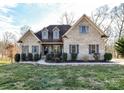 Beautiful brick home featuring manicured landscaping, gray shutters and a classic design for ideal curb appeal at 4130 Waterway Dr, Monroe, NC 28110