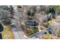 Aerial view of a traditional home nestled among mature trees in a quiet neighborhood at 1221 20Th Nw Ave, Hickory, NC 28601