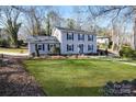 Inviting two-story home with a spacious front yard and beautiful landscaping at 1221 20Th Nw Ave, Hickory, NC 28601