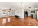 Spacious living room features hardwood floors and lots of natural light from the front picture window at 159 Creekwood Dr, Mooresville, NC 28117