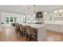 Stunning gourmet kitchen with large island, quartz countertops, and stainless steel appliances at 16112 Terry Ln, Huntersville, NC 28078
